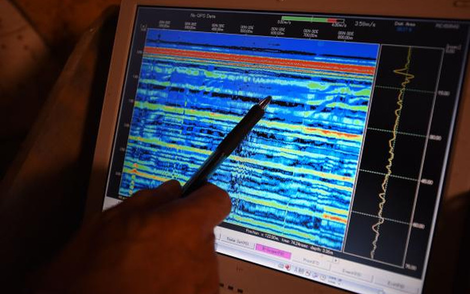 Watanabe points to radar data used to determine the material structure of the walls. Image: Brandon Quilicci, National Geographic